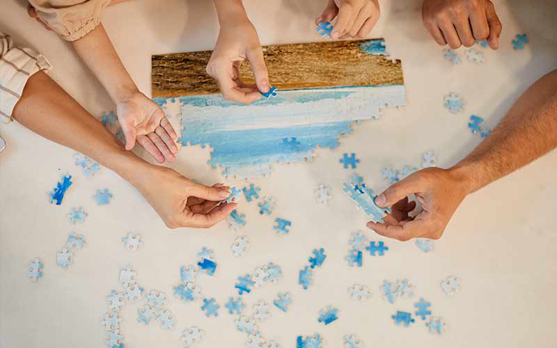 teen doing a jigsaw puzzle