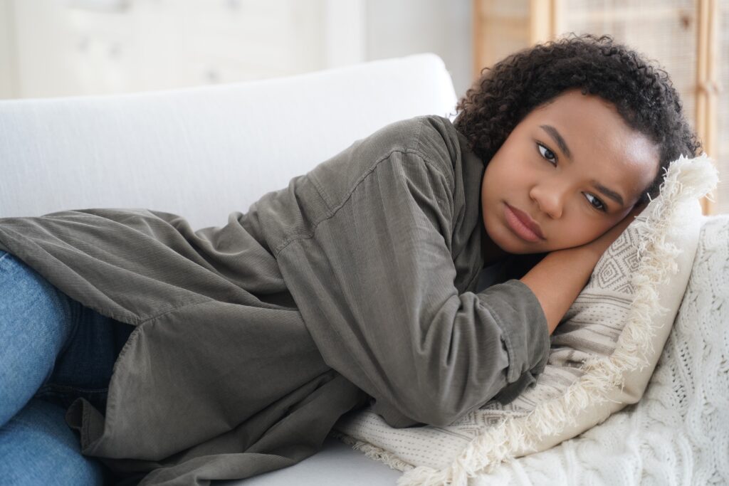 frustrated lonely teen girl is lying on couch at h 2022 06 28 09 35 05 utc